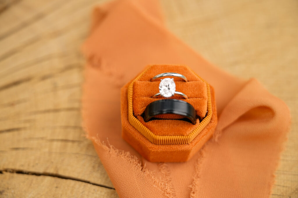 flat lay close up on wedding bands and engagement rings